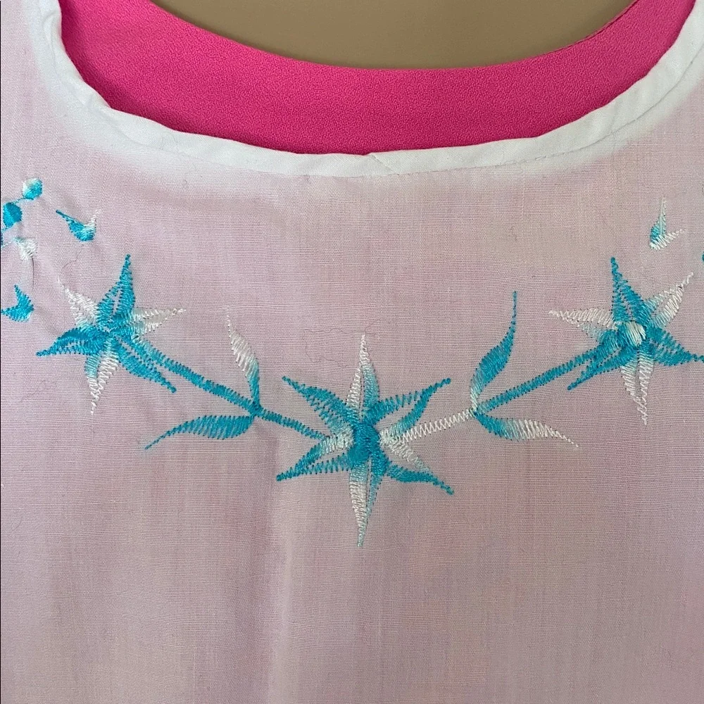 Vintage apron with blue embroidery